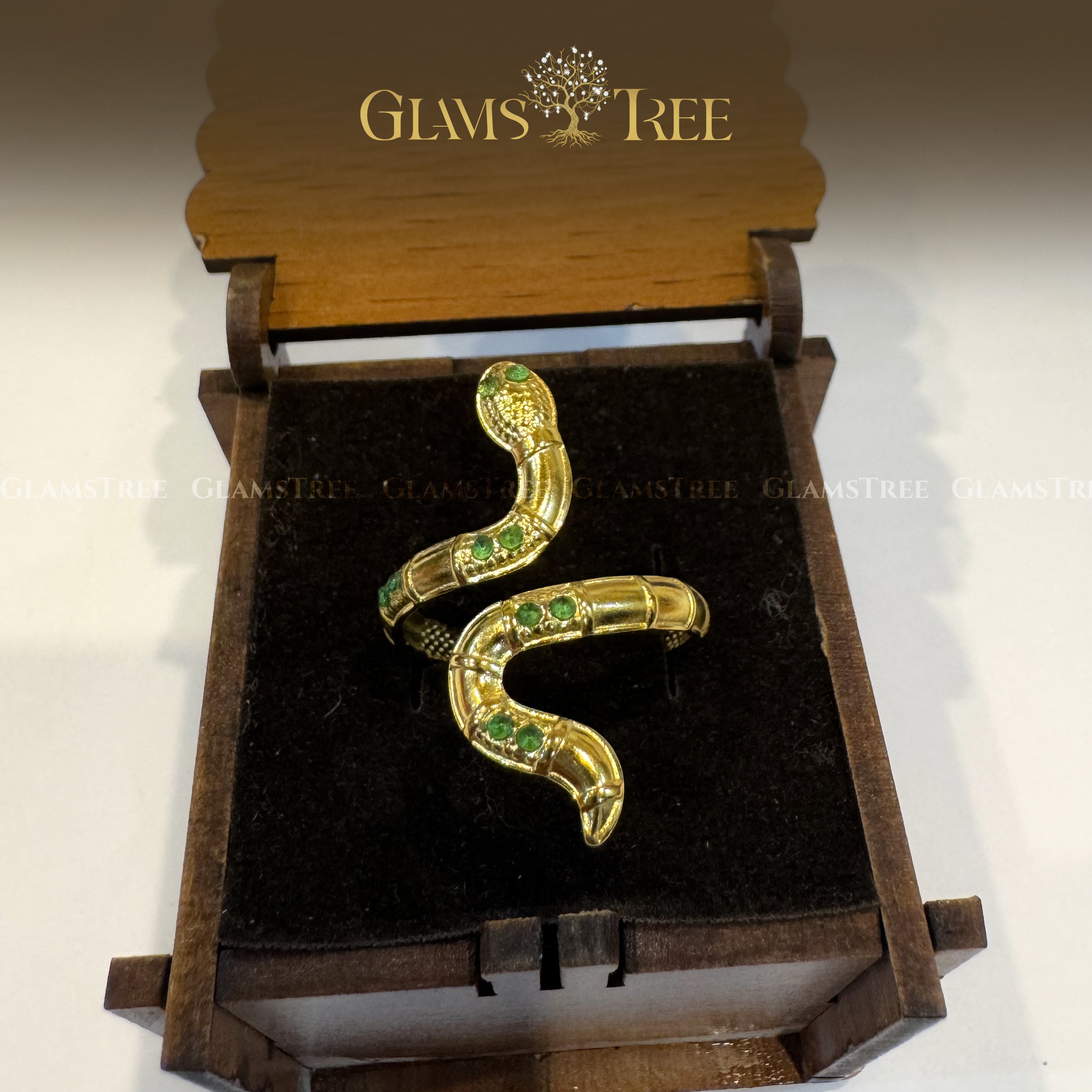 Vintage-Inspired Gold Snake Ring with Green Stones